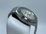 a close up of a watch on a white display stand
