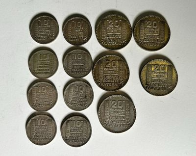 six different types of coins sitting on top of a white surface