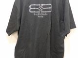 the back of a black shirt with a white logo on it