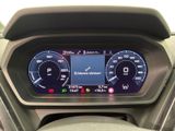 the dashboard of a car with a digital display on it
