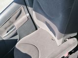 a dog that is sitting in the back seat of a car