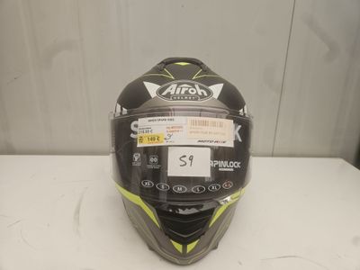 the helmet is black and yellow and has a sticker on it