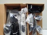 a box with a bunch of remotes inside of it