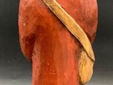 a clay figurine of a man with a hat on his head