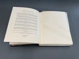 an open book sitting on top of a table on a table