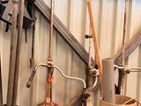 a lot of tools that are hanging up on the wall