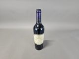 a bottle of wine that is sitting on a table