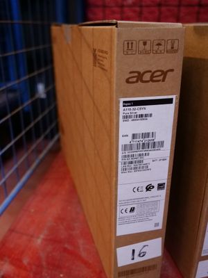 two boxes of acer products sit on a shelf in front of a cage