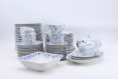 a lot of plates and cups on the table