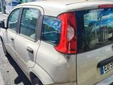 a small car that is parked in the parking lot