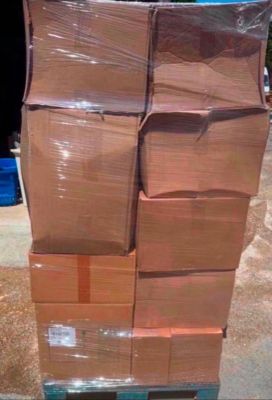 a large stack of boxes sitting on a pallet