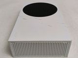 a white box with a black speaker on top of it