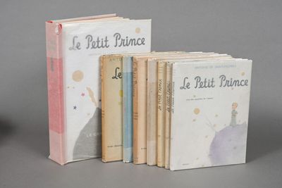 several books sitting on top of each other on a table