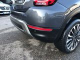 a close up of a car parked in a parking lot