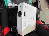 a laptop computer sitting on top of a backpack