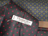 many different ties with different designs on them on a table