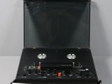 a black box with two speakers in it on a white surface
