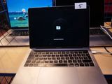 two laptops that are sitting on a desk