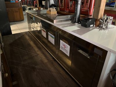 a picture of a restaurant counter with a coffee maker on it