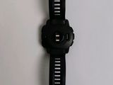 a close up of a watch on a white surface with a white background