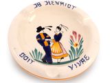 a plate with a picture of a man and a woman on it