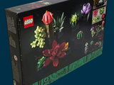 a box with a bunch of different flowers in it