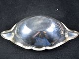 a silver plate with a little girl inside of it