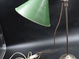 a green lamp that is sitting on a table