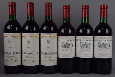 six bouteilles de vin rouge alignées sur une table