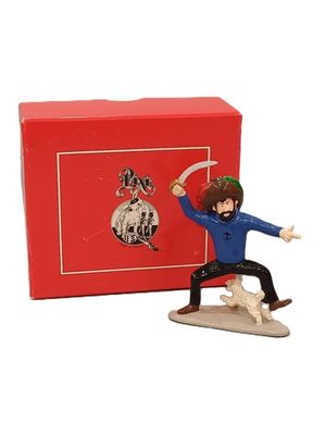 figurine représentant un homme sur une planche de surf devant une boîte rouge