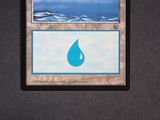 a close up of a card with a picture of a water drop on it
