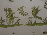 a plate with a picture of a fairy and a bird on it