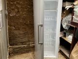 an image of a refrigerator that is in a room