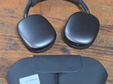 an image of a pair of headphones sitting on top of a wooden floor