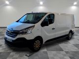 the white van is parked on a checkered floor in a room