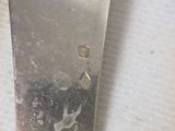 a knife that is sitting on top of a table
