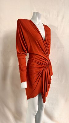 a mannequin wearing an orange dress on a white mannequin mannequin mannequin mann