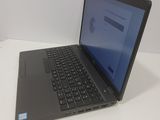 a laptop that is sitting on a white table