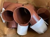 a cardboard box with a bunch of pipes inside of it