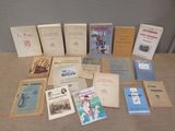 many books that are sitting on a table