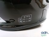a close up of a helmet on a white surface
