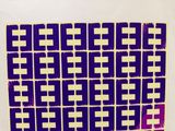 a picture of a purple and yellow pattern on a white wall