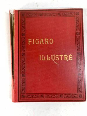 un vieux livre rouge posé sur une table blanche