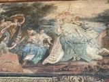 a large rug with a painting on it in the middle of a room