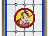 a painting of a woman holding a baby in a stained glass window