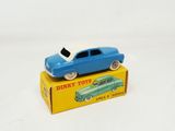 a blue toy car sitting on top of a yellow box
