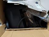 a cardboard box with a computer inside of it