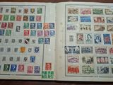 a book with stamps on it sitting on a table
