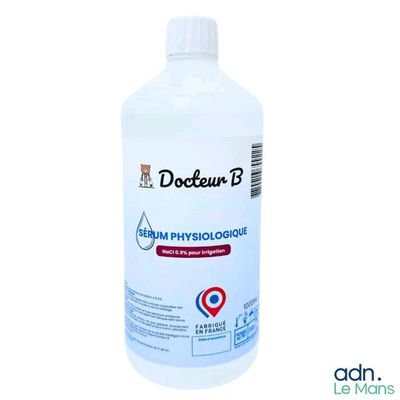 a close up of a bottle of liquid on a white background