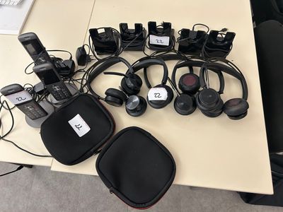 many headphones that are sitting on a table